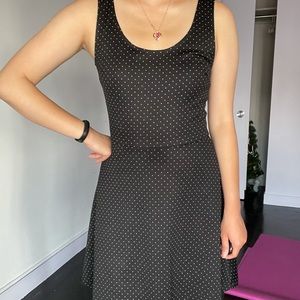 Black polka dotted cross back dress